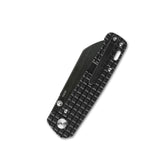 Closed QSP Penguin pocket knife with textured black titanium handle and sleek 154CM blade.